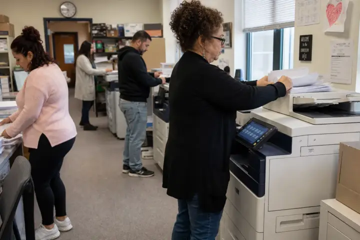Facilities manager reviewing a copier service contract